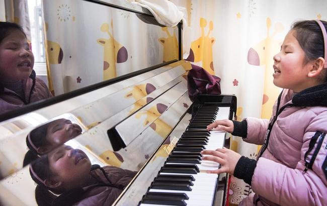 (圖片故事)盲童的鋼琴夢